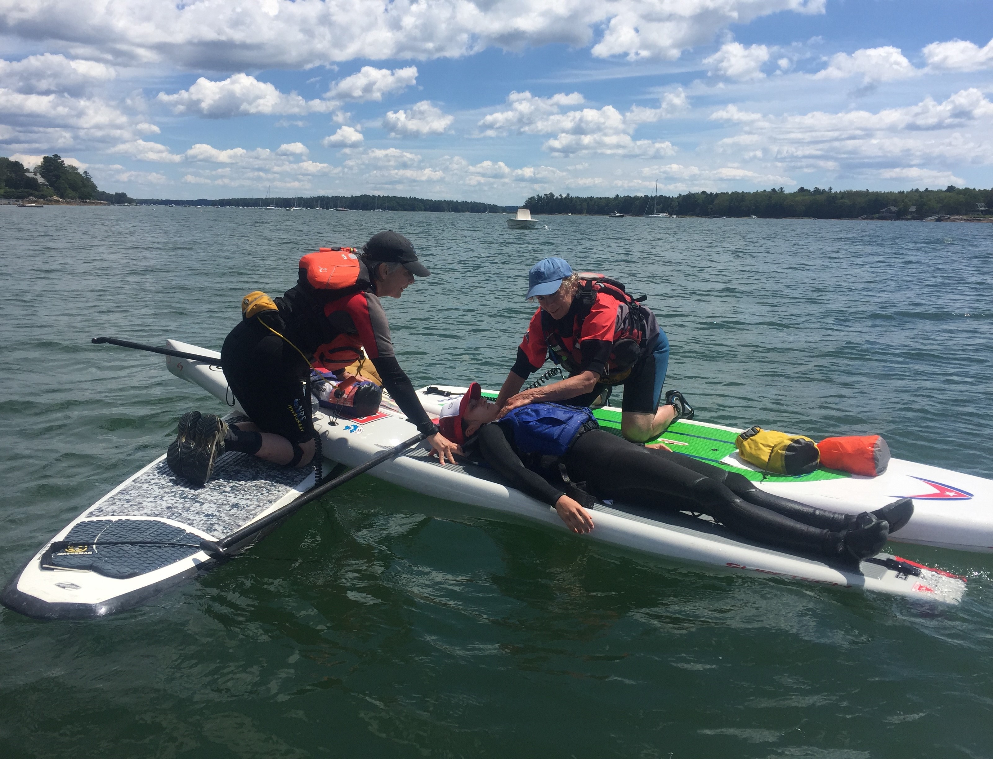 practicing first aid while on stand-up paddleboard